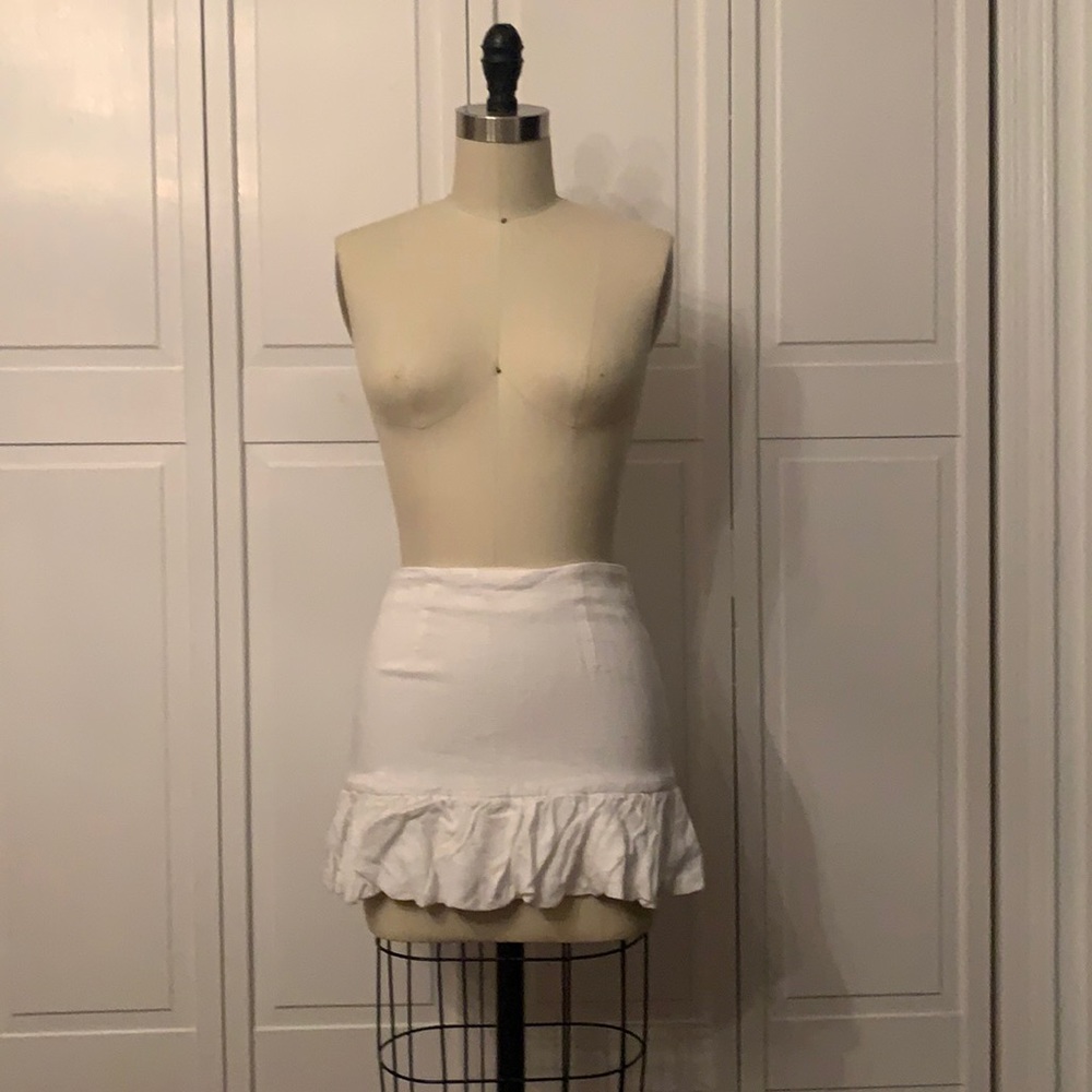 Mini skirt with ruffle hemline.